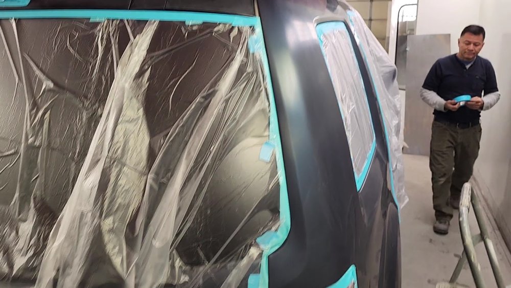 Panel masked for paint in the spray booth
