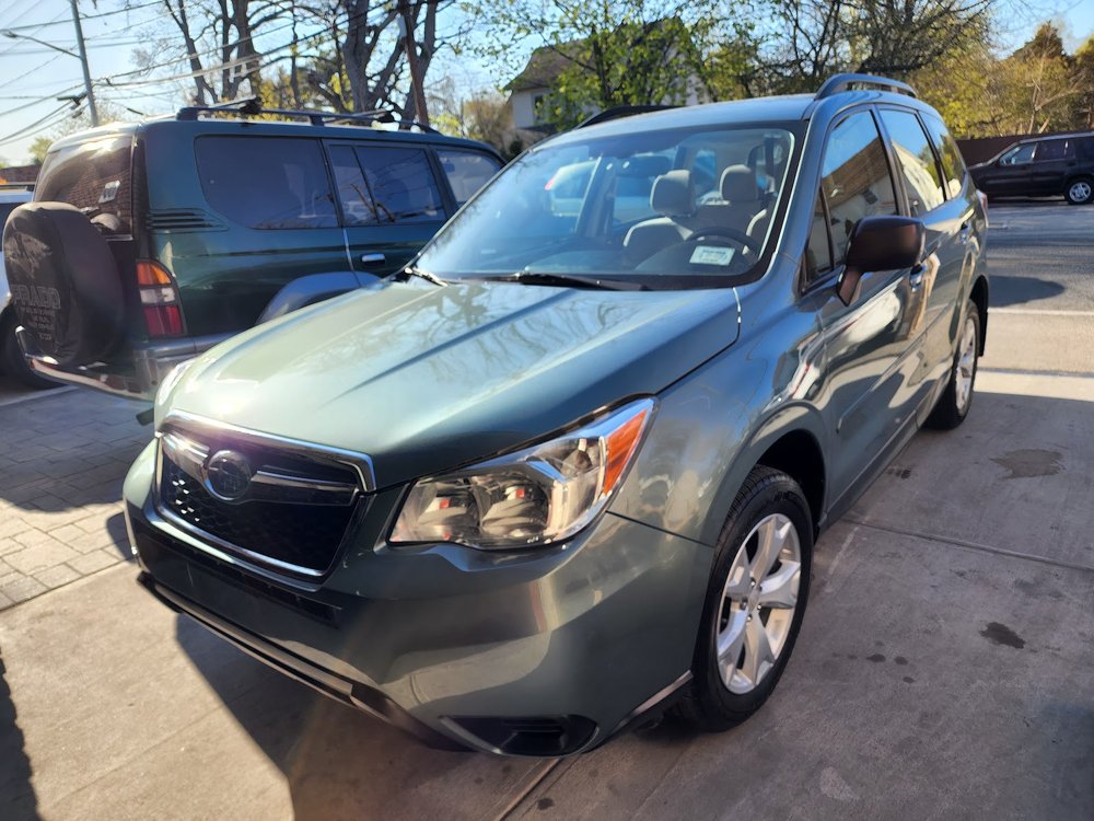 Green Subaru Forester after repair in Huntington Station