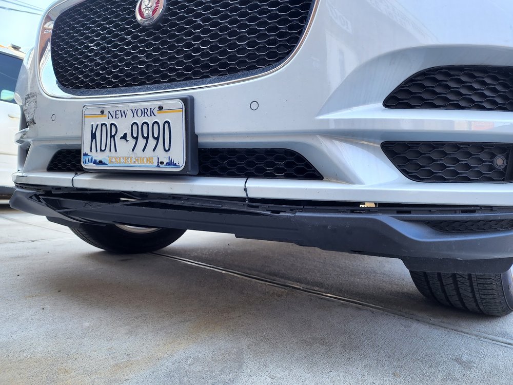 White SUV front bumper after repair