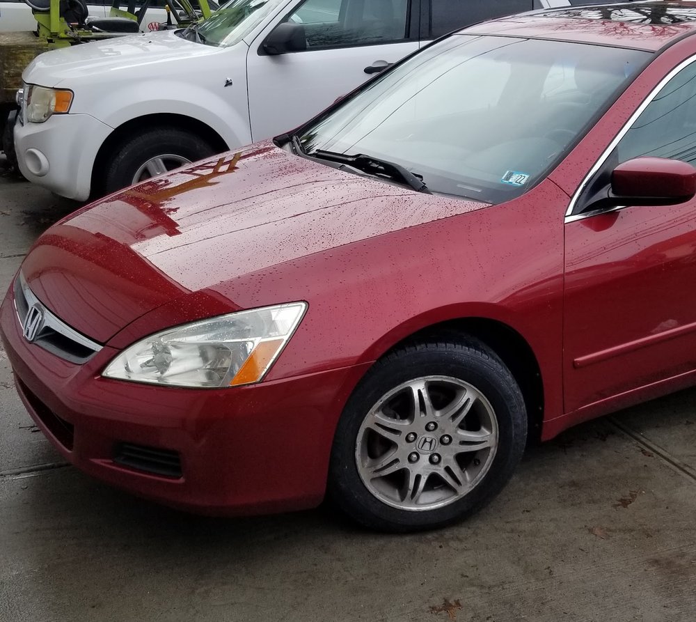 Red Honda Accord sedan after repair
